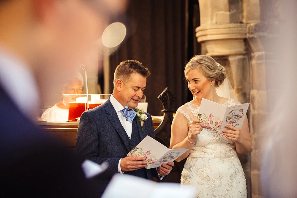 Bespoke tipi wedding order of service with bride and groom