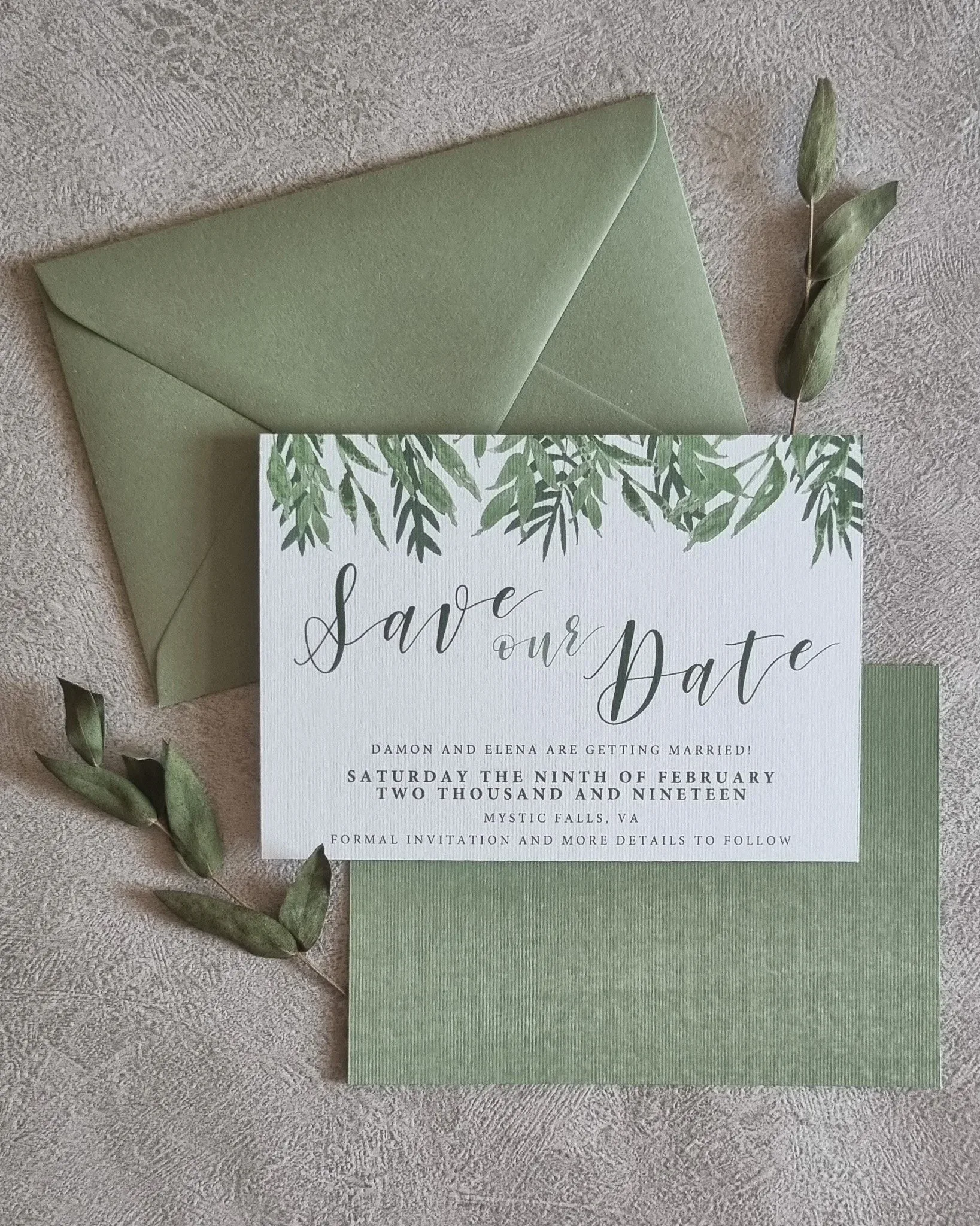 A cohesive wedding stationery suite showing invitations alongside on the day items like menus and place cards