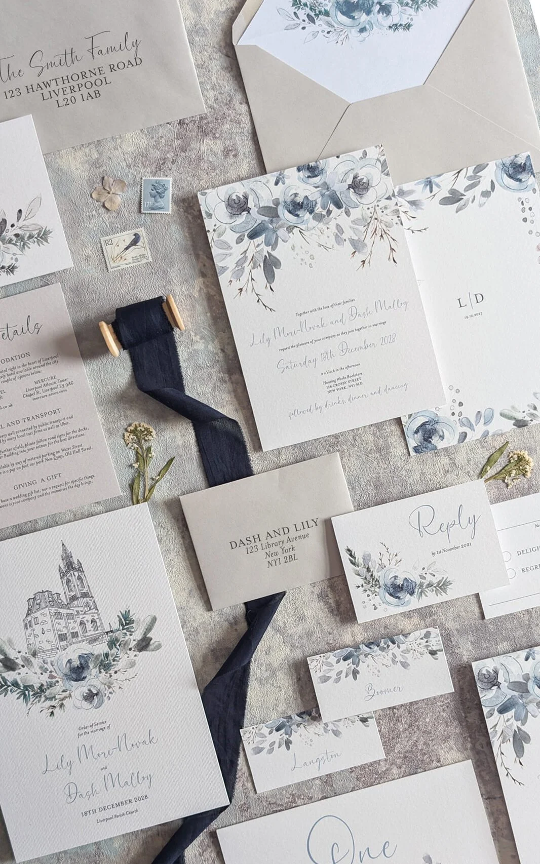 cool icy blue wedding invitation set with grey envelopes. watercolour florals and calligraphy style font.