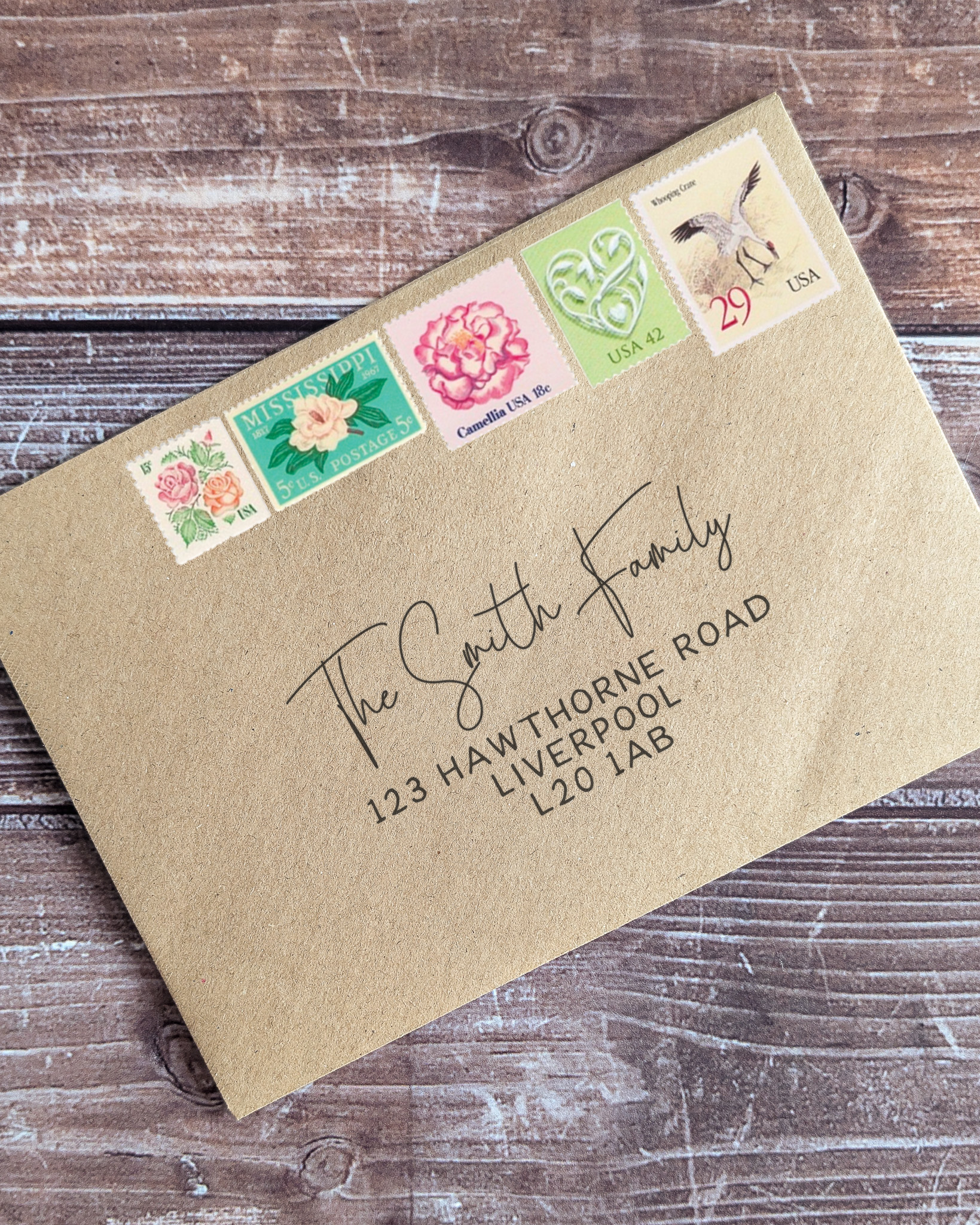 Vintage postage for a pastel wedding invitation envelope