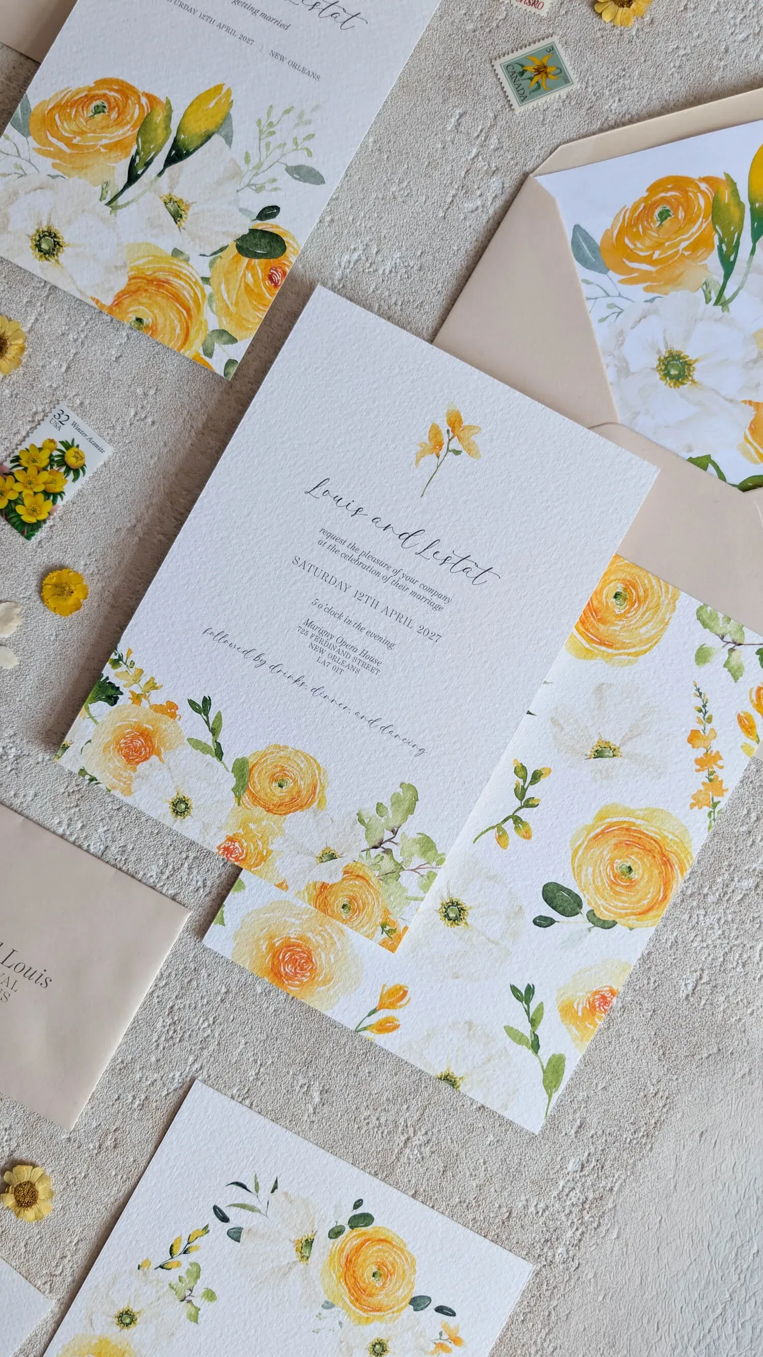 Hawthorne and Ivory Butter Yellow wedding invitation suite flat lay with watercolour yellow roses and coordinating cards