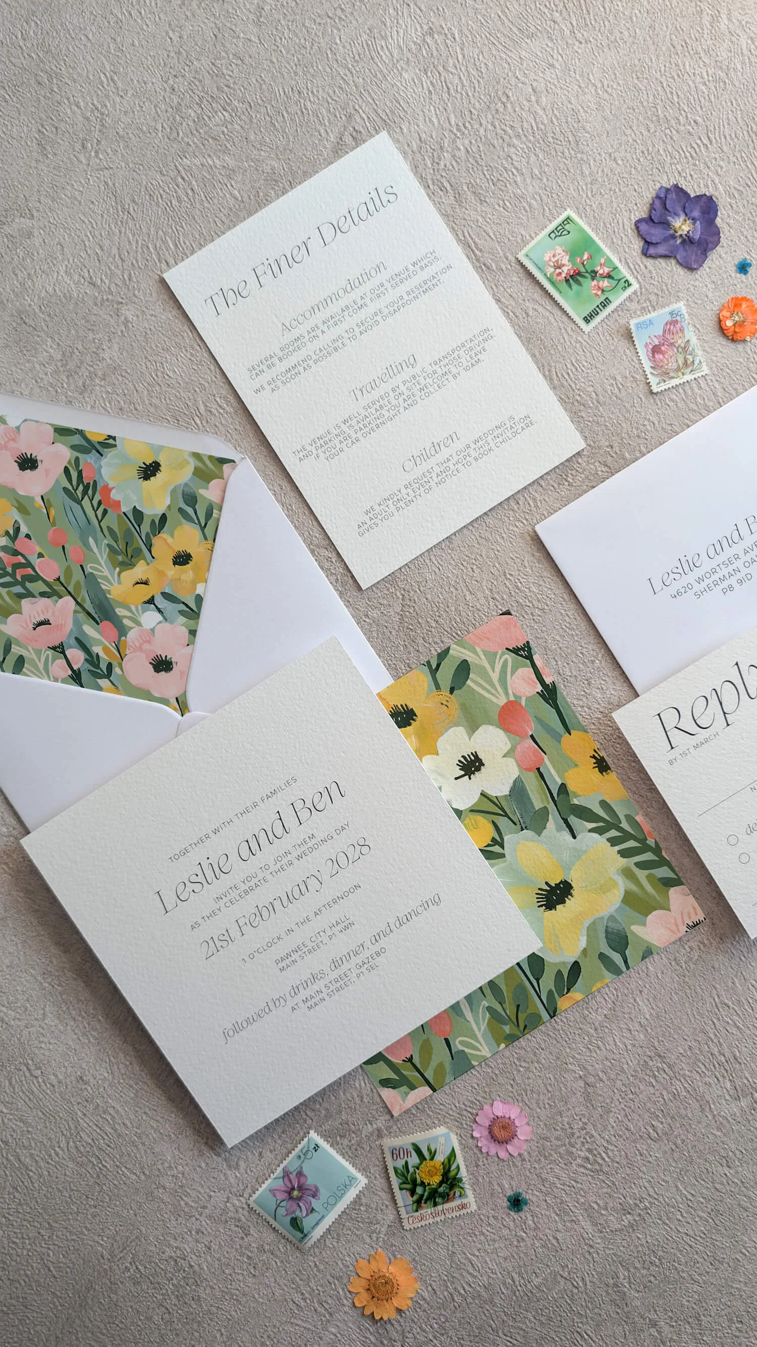 Studio Floral wedding invitation with envelope liner tied with green ribbon accent