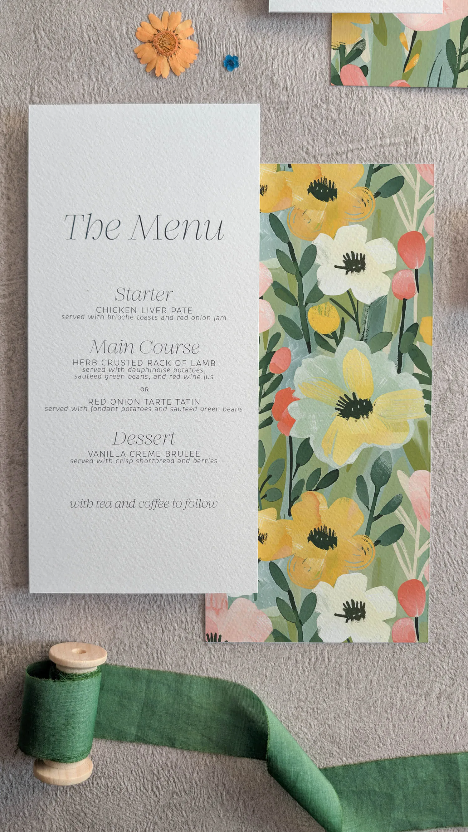 Studio Floral wedding place cards with colourful wildflower pattern along bottom border