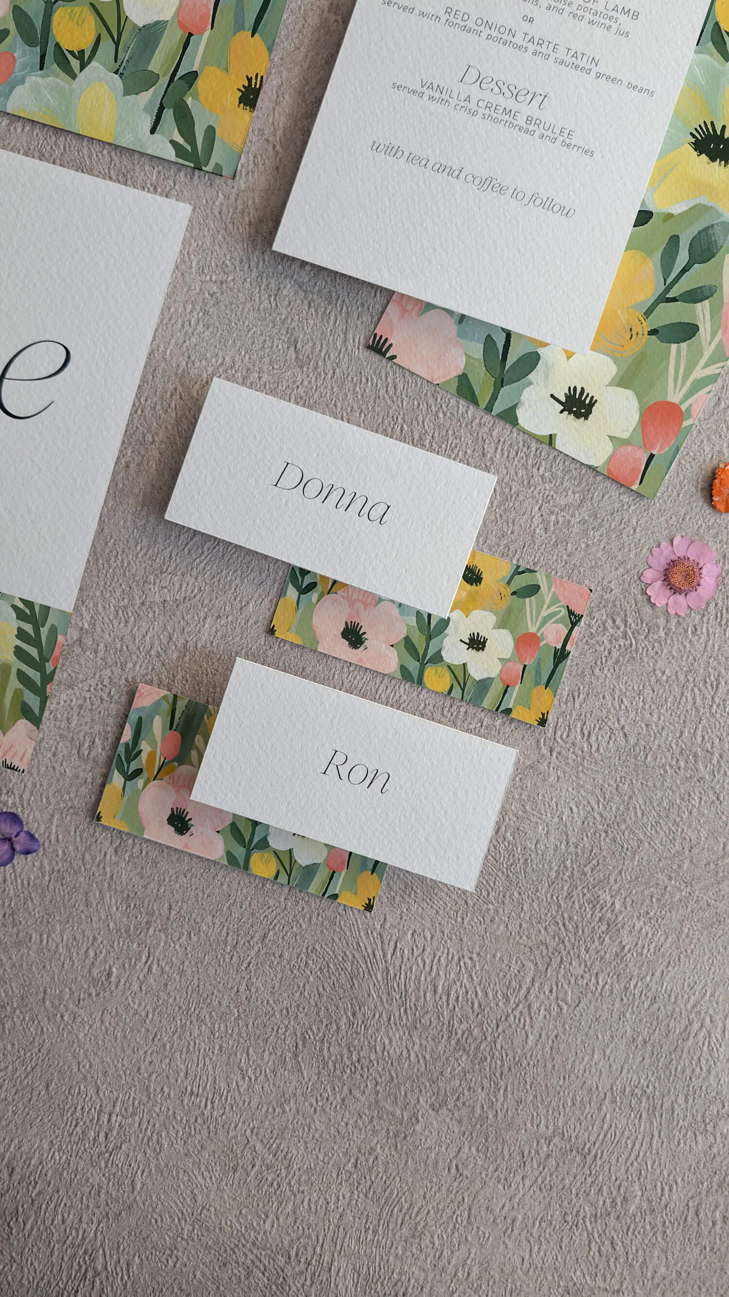 Studio Floral wedding menu card with yellow daisy and pink flower illustration